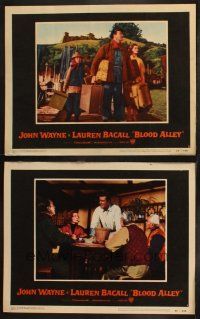 8a843 BLOOD ALLEY 2 LCs '55 John Wayne carrying Lauren Bacall's luggage, arriving in China!