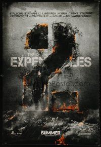 8b235 EXPENDABLES 2 teaser DS 1sh '12 image of tough-guy Sylvester Stallone in blown-up building!