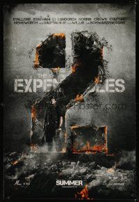 8h231 EXPENDABLES 2 teaser DS 1sh '12 image of tough-guy Sylvester Stallone in blown-up building!