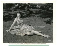 8k093 ANNE GWYNNE 8x10 still '42 full-length sitting on ground in pretty flowered dirndl dress!