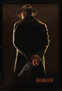 9a789 UNFORGIVEN undated teaser 1sh '92 classic image of gunslinger Clint Eastwood w/back turned!