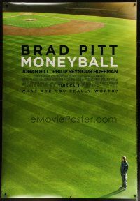 9c512 MONEYBALL DS bus stop '11 great image of Brad Pitt standing on baseball field!