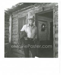 9t457 COWBOYS 8x10 still '72 big John Wayne with eyes closed & hands in pockets by log cabin!