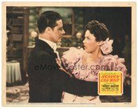 9y517 HEAVEN CAN WAIT LC '43 close up of Don Ameche holding shocked Gene Tierney, Ernst Lubitsch