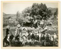 1h088 HOW THE WEST WAS WON candid 8x10 still '64 crew sets up wagon crossing scene on river bank!