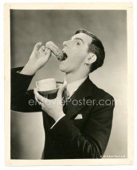 1h728 PALMY DAYS 8x10 still '31 c/u of Eddie Cantor demonstrating dunking donut in his coffee!