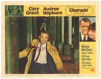 2k369 CHARADE LC #2 '63 great close up of Cary Grant running between stone pillars!