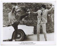 2x043 BACKFIRE 8x10 still '64 great c/u of Jean-Paul Belmondo fighting by cool car!