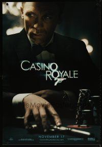 3f140 CASINO ROYALE teaser 1sh '06 Craig as James Bond sitting at poker table w/gun!