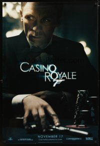 3p135 CASINO ROYALE teaser DS 1sh '06 Craig as James Bond sitting at poker table w/gun!