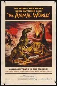 3r007 ANIMAL WORLD linen 1sh '56 great artwork of prehistoric dinosaurs & erupting volcano!