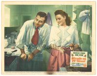 3y683 MIRACLE ON 34th STREET LC #6 '47 Maureen O'Hara is amused by John Payne in the kitchen!