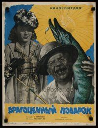 4a704 DRAGOTSENNYY PODAROK Russian 15x20 '56 great Manukhin art of man w/fish & disapproving woman!