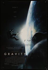 4b335 GRAVITY October style advance DS 1sh '13 Sandra Bullock, George Clooney, adrift over Earth!