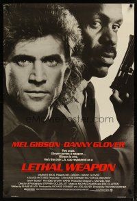 4b495 LETHAL WEAPON advance 1sh '87 great close image of cop partners Mel Gibson & Danny Glover!