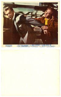 4k133 GOLDFINGER color English FOH LC '64 c/u of Honor Blackman grabbing Sean Connery as James Bond