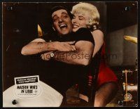 4p198 LET'S MAKE LOVE German LC '60 c/u of sexy Marilyn Monroe hugging Yves Montand from behind!