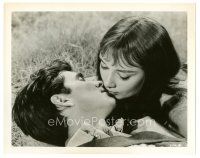 4p477 GREEN MANSIONS 8x10.25 still '59 c/u of Audrey Hepburn & Anthony Perkins kissing on ground!