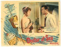 5j454 DOCTOR AT SEA English LC '55 Dirk Bogarde stares at sexy Brigitte Bardot only wearing towel!