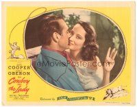 5j435 COWBOY & THE LADY LC R44 c/u of Gary Cooper kissing Merle Oberon holding up three fingers!