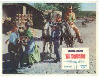 5j472 EL DORADO LC #5 '66 John Wayne on horseback rides through village, Howard Hawks!