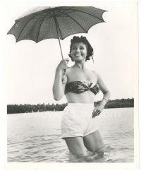 5k761 RITA HAYWORTH 8x10.25 still '56 standing in water in skimpy swimsuit & holding umbrella!