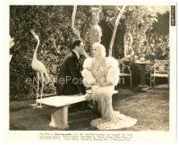 6c381 GOIN' TO TOWN deluxe 8.25x10 still '35 Paul Cavanagh & sexy Mae West sitting on bench!
