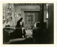 6c920 TRAIL OF '98 8.25x10 still '28 Dolores Del Rio in barren room warming herself by wood stove!