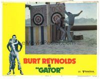 6h363 GATOR LC #2 '76 great image of Burt Reynolds kicking guy on beach by dart game!