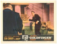 6h388 GOLDFINGER LC #4 '64 Sean Connery as James Bond about to throw stick at Harold Oddjob Sakata