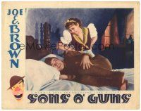 6h817 SONS O' GUNS LC '36 pretty Joan Blondell smiles at soldier Joe E. Brown in uniform on bed!