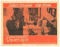 6h944 VERTIGO LC #5 '58 Alfred Hitchcock, standing James Stewart on phone,blonde Kim Novak in bed!