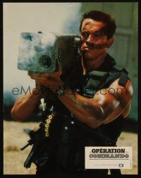 7e097 COMMANDO French LC '85 close up of Arnold Schwarzenegger firing wacky weapon!