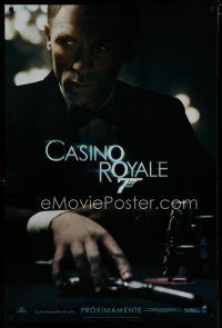 7f123 CASINO ROYALE Spanish/U.S. teaser DS 1sh '06 Craig as James Bond sitting at poker table w/gun!
