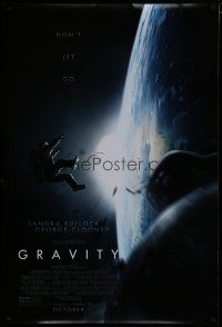 7f311 GRAVITY October advance DS 1sh '13 Sandra Bullock, George Clooney, adrift over earth!