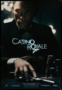 7k147 CASINO ROYALE teaser DS 1sh '06 Craig as James Bond sitting at poker table w/gun!