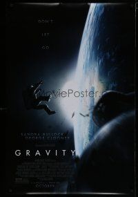 7k326 GRAVITY October advance DS 1sh '13 Sandra Bullock, George Clooney, adrift over earth!