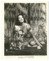 7s184 DARK WATERS 8.25x10.25 still '44 c/u of sexy Merle Oberon with flowers in her lap!