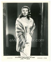 7s257 FIRE DOWN BELOW 8.25x10 still '57 Rita Hayworth standing in sexy dress wearing fur!