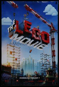 7w384 LEGO MOVIE teaser DS 1sh '14 cool image of title assembled w/cranes & plastic blocks!
