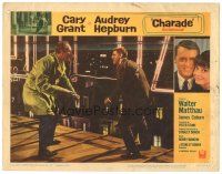7z241 CHARADE LC #7 '63 close up of tough Cary Grant in fight with George Kennedy on roof!