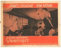 7z944 VERTIGO LC #8 '58 Alfred Hitchcock, standing James Stewart glares at blonde Kim Novak!