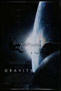 8c314 GRAVITY October advance DS 1sh '13 Sandra Bullock, George Clooney, adrift in space!