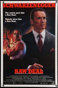 8c623 RAW DEAL 1sh '86 art of tough guy Arnold Schwarzenegger with gun & in suit!