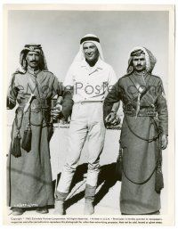 8h558 LAWRENCE OF ARABIA candid 8x10.25 still '63 Peter O'Toole holding hands with two Arab men!