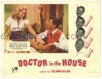 8p451 DOCTOR IN THE HOUSE English LC '55 image of Dr. Dirk Bogarde examining sexy Muriel Pavlow!