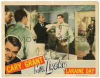 8p691 MR. LUCKY LC '43 Laraine Day watches dapper gambler Cary Grant get dressed!