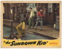 8p878 SUNDOWN KID LC '42 cowboy Don Red Barry clears trash from the sidewalk!
