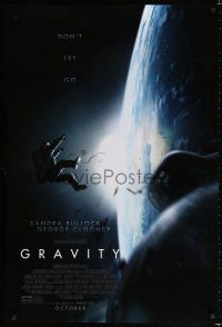 8t310 GRAVITY October advance DS 1sh '13 Sandra Bullock, George Clooney, adrift in space!