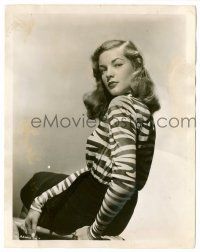 9a525 LAUREN BACALL 8x10.25 still '40s the sexy movie discovery of 1944 seated in zebra stripes!